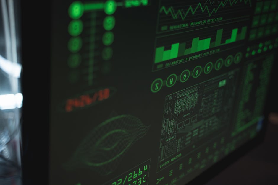 Close-up view of a computer displaying cybersecurity and data protection interfaces in green tones.