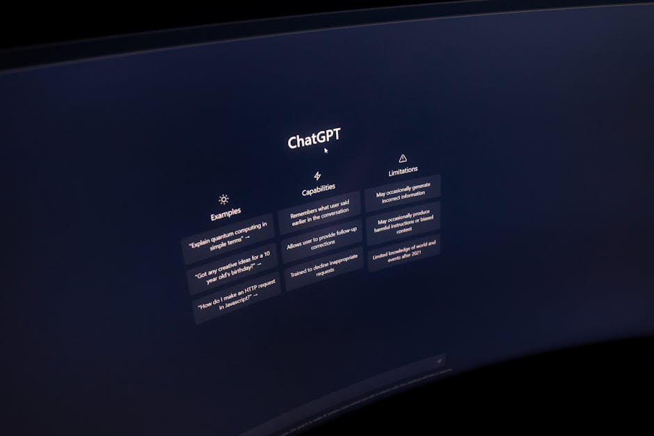 Close-up of a computer screen displaying ChatGPT interface in a dark setting.