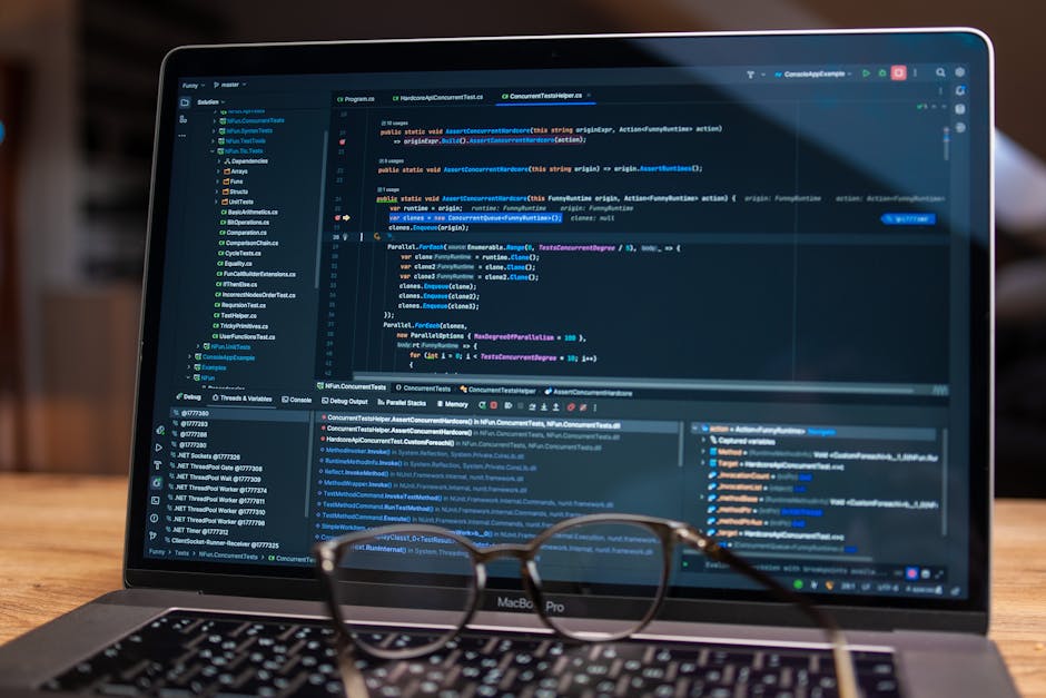 Laptop screen showing debugging software with code, perfect for tech and software development themes.
