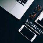 Top view of a modern digital workspace with blockchain theme essentials.